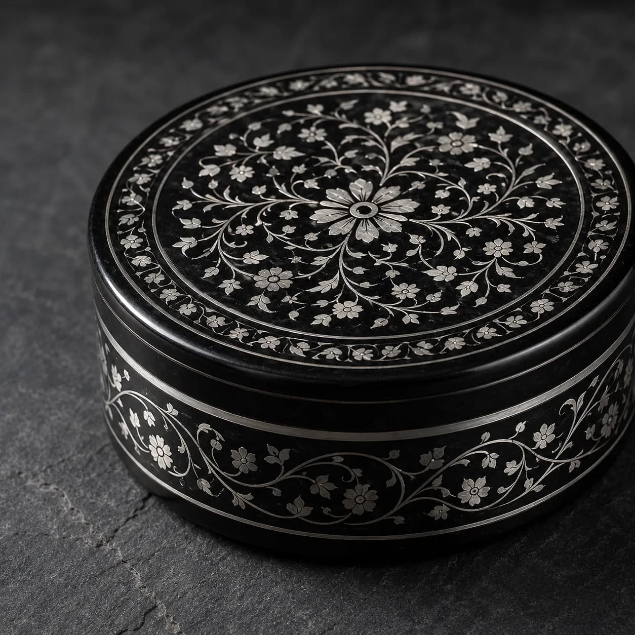 Blackened zinc-copper alloy craft inlaid with pure silver wire patterns from Bidar